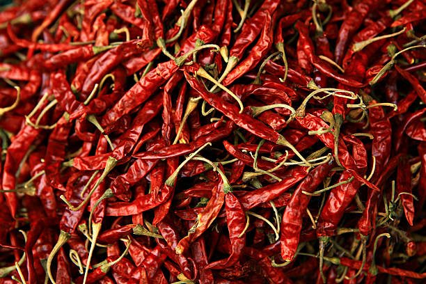 The combined, dried chillies are many red pigments background texture